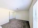 Empty bedroom with neutral walls and carpet at 18844 Hampstead Heath Ct, Land O Lakes, FL 34638