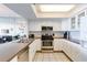 Modern kitchen with stainless steel appliances and white cabinets at 20002 Gulf Blvd # 2604, Indian Shores, FL 33785