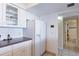 Kitchen with white cabinets, stainless steel appliances, and ocean view at 20002 Gulf Blvd # 2604, Indian Shores, FL 33785