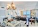 Living room with ocean view, leather couches, and glass dining table at 20002 Gulf Blvd # 2604, Indian Shores, FL 33785