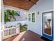 Inviting back porch with wooden ceiling and access to garden at 207 28Th N Ave, St Petersburg, FL 33704