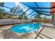 Screened-in pool with a blue liner and metal frame with white fence at 2233 Curlew Rd, Dunedin, FL 34698