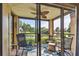 Screened balcony with tranquil water views at 2400 Feather Sound Dr # 515, Clearwater, FL 33762