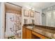 Bathroom featuring granite countertops and a shower/tub combo at 2400 Feather Sound Dr # 515, Clearwater, FL 33762