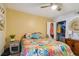 Bright bedroom featuring floral bedspread, open closet, and nightstand at 2400 Feather Sound Dr # 515, Clearwater, FL 33762