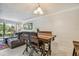 Dining area with a wooden table and gray sofa at 2400 Feather Sound Dr # 515, Clearwater, FL 33762