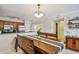 Inviting kitchen with stainless steel appliances, wood cabinets, and breakfast bar at 2400 Feather Sound Dr # 515, Clearwater, FL 33762
