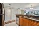 Kitchen with wood cabinets, granite countertops, and stainless steel appliances at 2400 Feather Sound Dr # 515, Clearwater, FL 33762