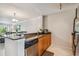 Kitchen with wood cabinets, granite countertops, and stainless steel appliances at 2400 Feather Sound Dr # 515, Clearwater, FL 33762