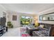 Spacious living room with sliding glass doors leading to a balcony at 2400 Feather Sound Dr # 515, Clearwater, FL 33762