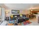 Open-concept living and dining area with sliding glass doors to the balcony at 2400 Feather Sound Dr # 515, Clearwater, FL 33762