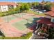 Community tennis courts surrounded by lush landscaping at 2400 Feather Sound Dr # 515, Clearwater, FL 33762