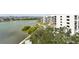 Scenic aerial view of the building, pool, and surrounding waterfront at 4 Belleview Blvd # 801, Belleair, FL 33756