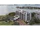High-rise condo building with a circular driveway and view of the water and golf course at 4 Belleview Blvd # 801, Belleair, FL 33756
