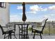 Outdoor balcony area perfect for enjoying waterfront views, includes a small table and two chairs at 4 Belleview Blvd # 801, Belleair, FL 33756
