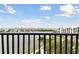 Balcony with stunning waterfront views, black metal railing, and clear blue skies at 4 Belleview Blvd # 801, Belleair, FL 33756