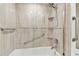 Modern bathroom with tiled shower and grab bars for added accessibility at 4 Belleview Blvd # 801, Belleair, FL 33756