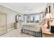 Spacious primary bedroom with a ceiling fan, balcony access, and tiled flooring at 4 Belleview Blvd # 801, Belleair, FL 33756