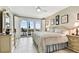 Large bedroom with balcony access, ceiling fan and tile floors at 4 Belleview Blvd # 801, Belleair, FL 33756