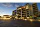 Modern condominium building with elegant nighttime lighting at 4 Belleview Blvd # 801, Belleair, FL 33756