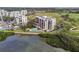 Modern condo building with pool, situated on a waterfront golf course at 4 Belleview Blvd # 801, Belleair, FL 33756