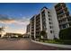Modern condominium building exterior at sunset at 4 Belleview Blvd # 801, Belleair, FL 33756