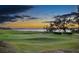 Scenic golf course with water view and sunset at 4 Belleview Blvd # 801, Belleair, FL 33756