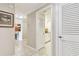 Hallway leading to a laundry room and the kitchen and dining area at 4 Belleview Blvd # 801, Belleair, FL 33756