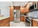 Remodeled kitchen with stainless steel appliances, granite countertops, and plenty of cabinet space at 4 Belleview Blvd # 801, Belleair, FL 33756