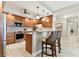 Updated kitchen with granite counters, stainless steel appliances, wood cabinets, and breakfast bar at 4 Belleview Blvd # 801, Belleair, FL 33756