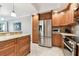 Updated kitchen with stainless steel appliances and granite countertops at 4 Belleview Blvd # 801, Belleair, FL 33756