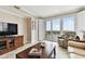 Comfortable living room with water views, plush seating, and sliding glass doors to balcony at 4 Belleview Blvd # 801, Belleair, FL 33756