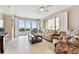 Living room with comfortable seating, large windows offering scenic views, and tile flooring at 4 Belleview Blvd # 801, Belleair, FL 33756