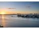 Stunning sunset view over the ocean with buildings and boats in the distance at 4 Belleview Blvd # 801, Belleair, FL 33756