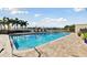 Community pool with waterfront views and lounge chairs at 4 Belleview Blvd # 801, Belleair, FL 33756