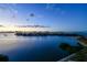 Stunning waterfront view with island homes and cityscape at sunset at 4 Belleview Blvd # 801, Belleair, FL 33756