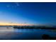 Evening waterfront view with island homes and a colorful sunset at 4 Belleview Blvd # 801, Belleair, FL 33756