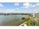 Stunning waterfront view with boats and buildings in the distance at 4 Belleview Blvd # 801, Belleair, FL 33756