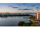 Stunning waterfront view with boats and city skyline at sunset at 4 Belleview Blvd # 801, Belleair, FL 33756
