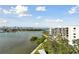 Beautiful waterfront view with a condo building, boats, and lush greenery at 4 Belleview Blvd # 801, Belleair, FL 33756