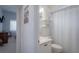 Clean bathroom with a shower/tub combo and updated vanity at 4050 Eagle Cove East Dr, Palm Harbor, FL 34685