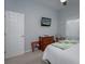 Spacious bedroom with king-size bed and wood dresser at 4050 Eagle Cove East Dr, Palm Harbor, FL 34685