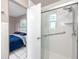 Bathroom with a walk-in shower, a bedroom view, and grab bars at 4227 6Th N Ave, St Petersburg, FL 33713