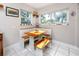 Bright breakfast nook with wooden table and bench seating at 4227 6Th N Ave, St Petersburg, FL 33713