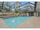 Refreshing screened-in pool and spa area at 44 Pinewood Cir, Safety Harbor, FL 34695