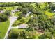 An aerial view showcasing the home, yard, and surrounding neighborhood at 4508 Redcoat Dr, Wesley Chapel, FL 33543