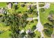 An aerial view of a home situated on a large corner lot in a residential area at 4508 Redcoat Dr, Wesley Chapel, FL 33543