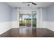 Living room with sliding glass doors leading to a screened patio at 4770 White Sanderling Ct, Tampa, FL 33619