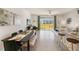 Dining area with table, chairs, and view of the backyard at 5047 Captain Davis Dr, Wimauma, FL 33598