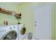 Convenient laundry room with washer, dryer, and storage at 5112 Twin Creeks Dr, Valrico, FL 33596